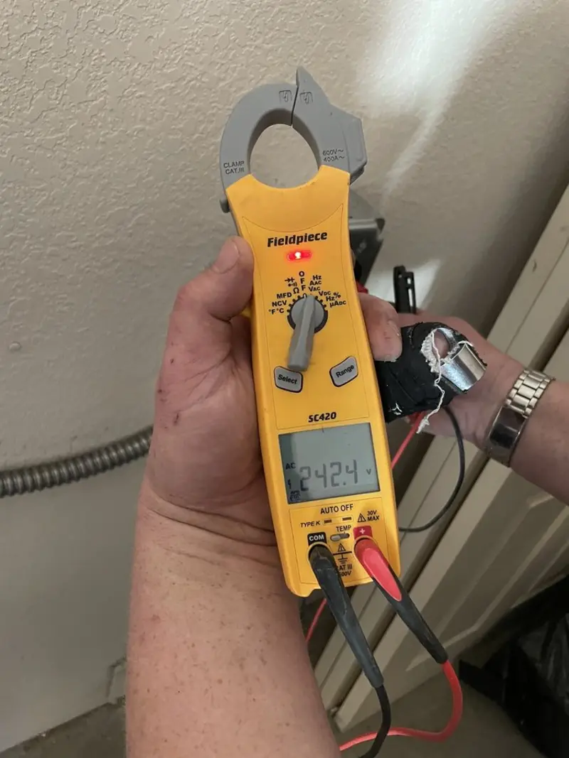 Voltage testing with clamp meter during Hot Tub / Pool Electrical Wiring in Portage